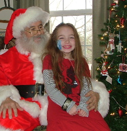 Santa Dennis with smiling child